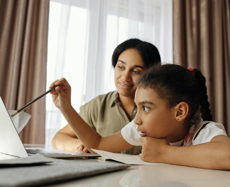 Photo: Parent and child at computer